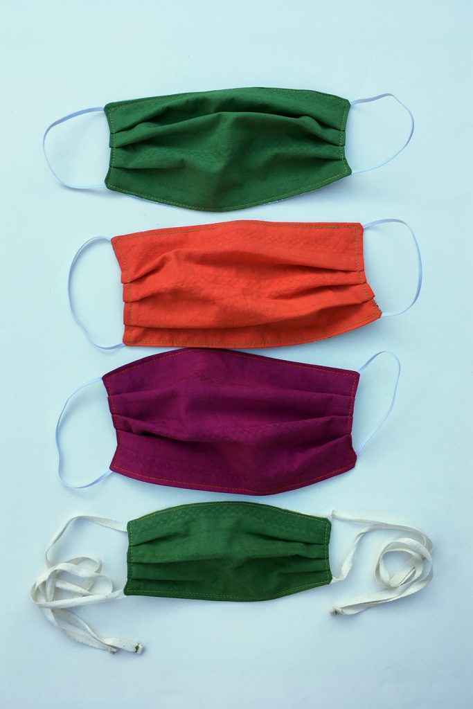 face mask options in organic cotton hand dyed in leaf green, orange poppy, fuchsia and kid size with elastic loops or ties