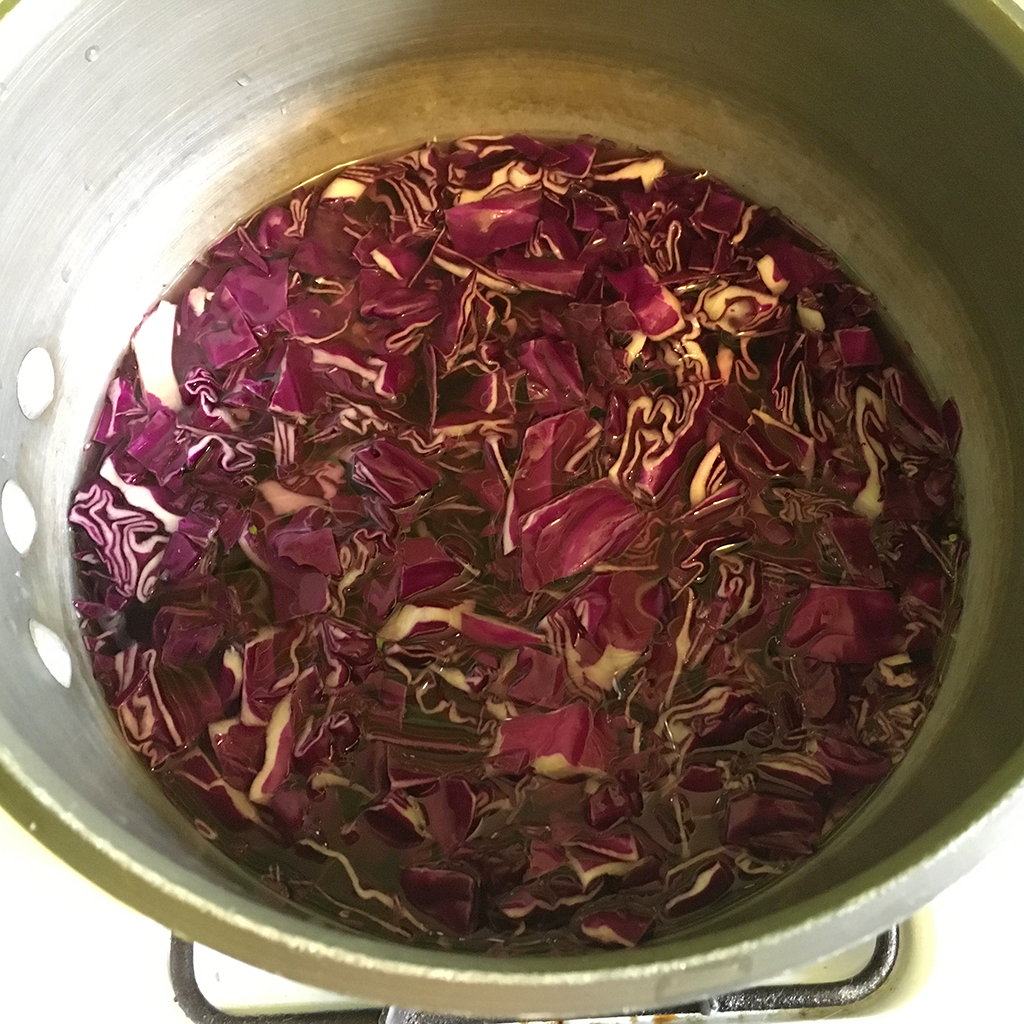red cabbage cooking in pot to make natural egg dye