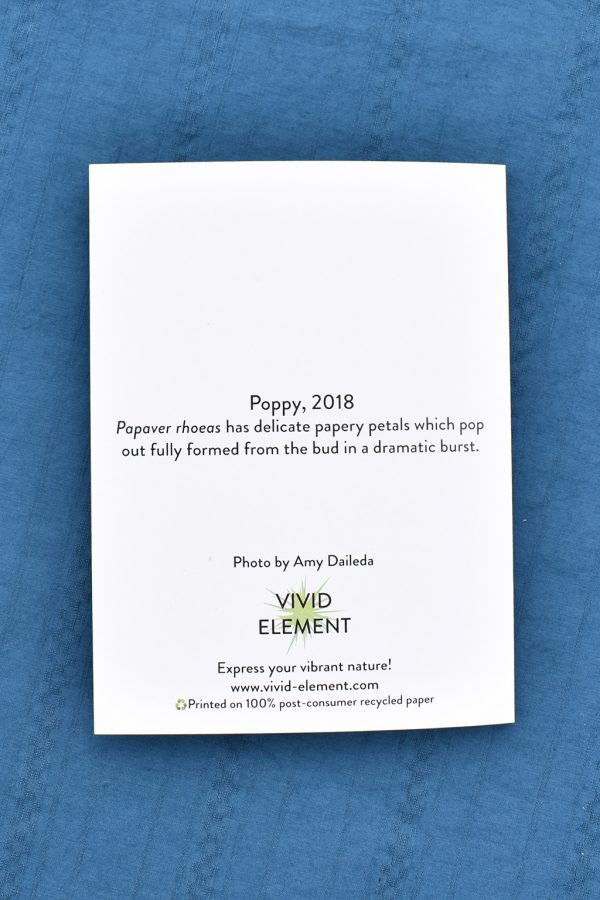 image of back of greeting card that says "Poppy, 2018 Papaver rhoeas has delicate papery petals which pop out fully formed from the bud in a dramatic burst."