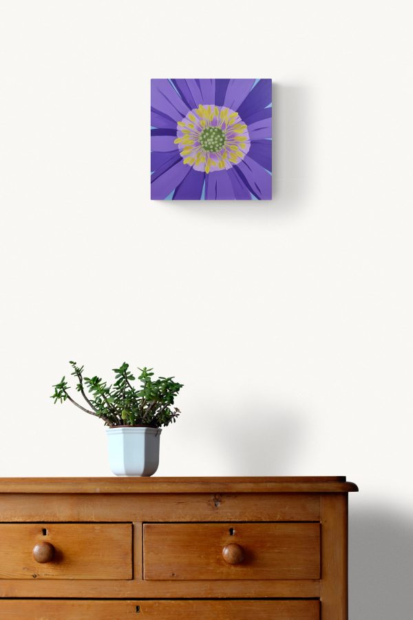 Anemone blanda botanical painting on a wall above a dresser.